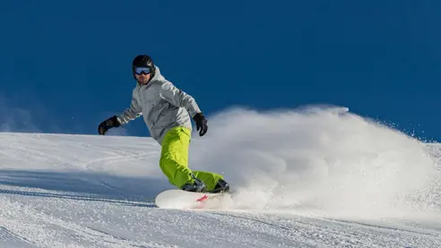 Stå på snowboard i Lofer, lækre pister.